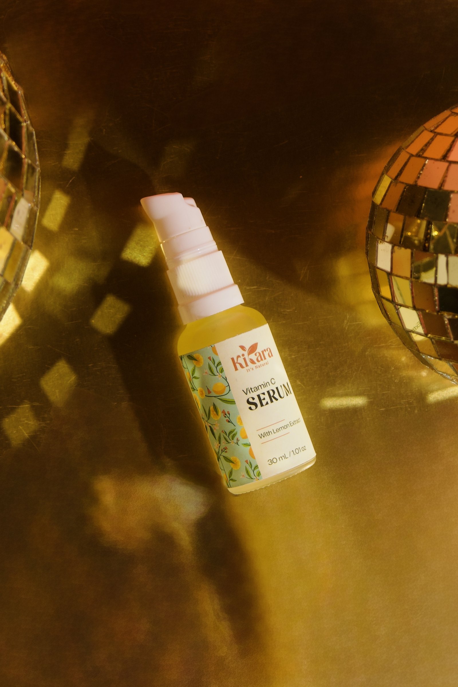 Kiyara Vitamin C Serum on gold background